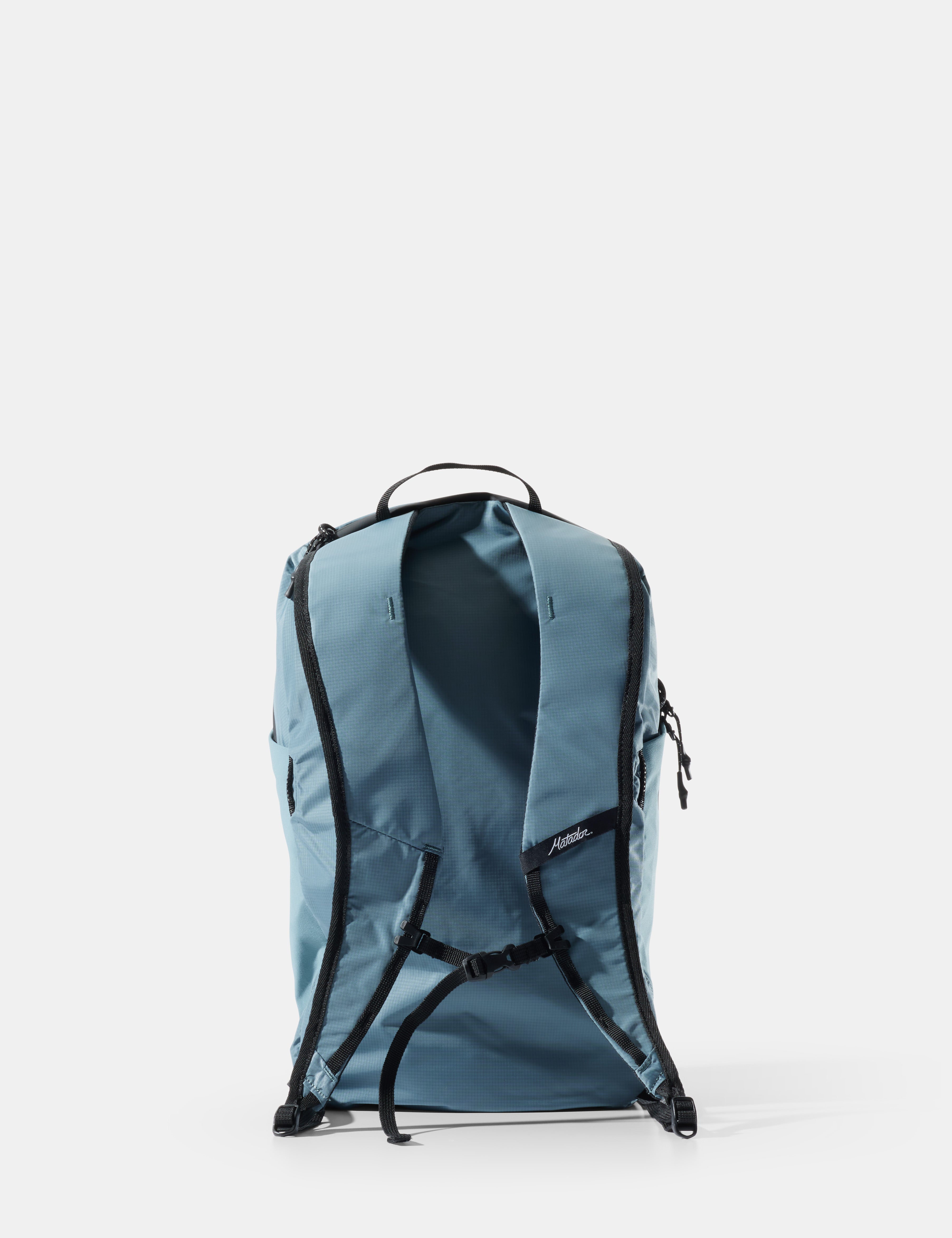 Blue backpack with black straps on a white background